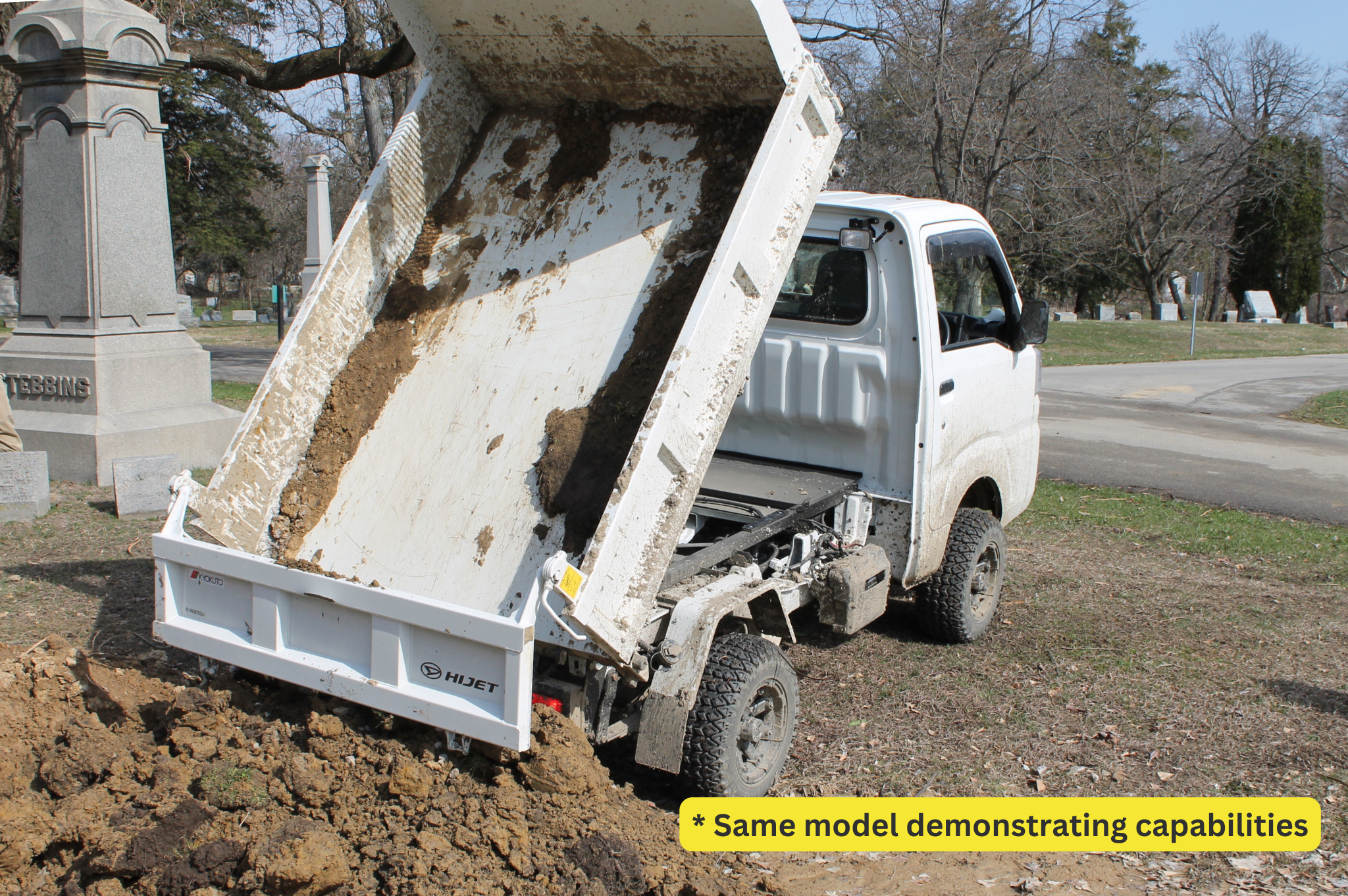 Daihatsu Hijet HD Dump dumping out soil.